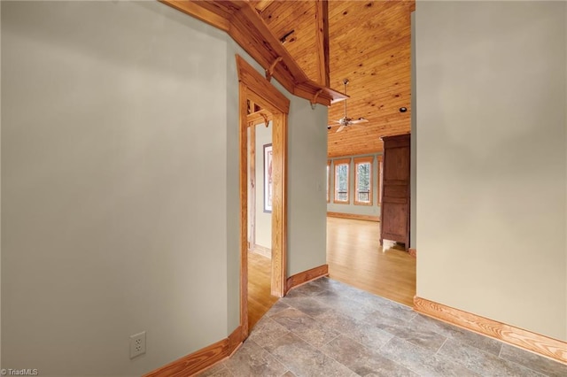hall featuring high vaulted ceiling and wood ceiling