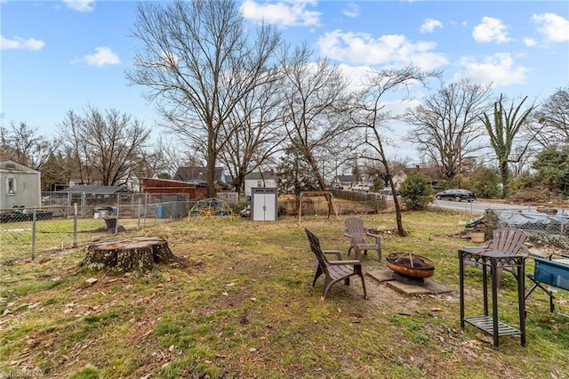 view of yard with an outdoor fire pit