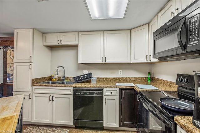 kitchen featuring wood counters, sink, white cabinets, light tile patterned floors, and black appliances