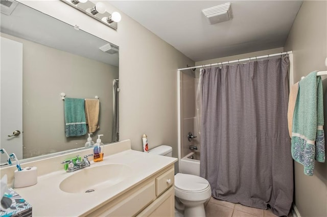 full bathroom featuring vanity, shower / tub combo with curtain, tile patterned floors, and toilet