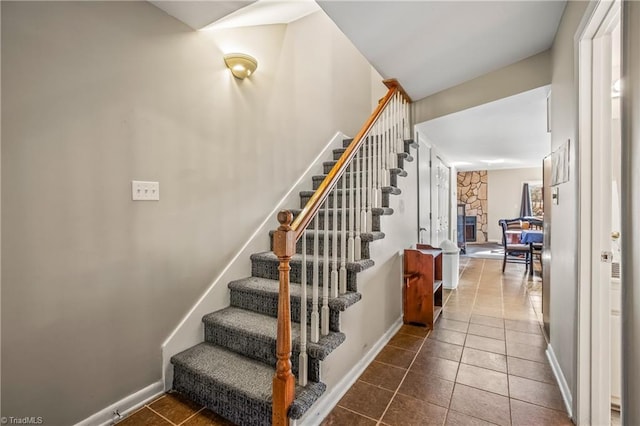 stairs featuring tile patterned floors