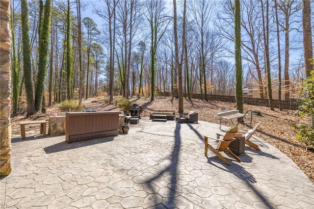 view of patio / terrace featuring fence