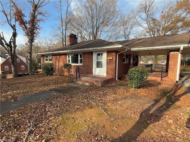 exterior space with a carport