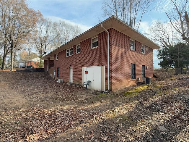 view of side of home featuring cooling unit