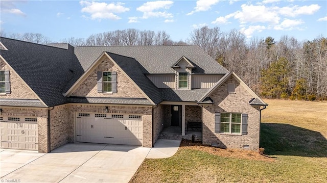 view of front of home featuring a garage and a front lawn