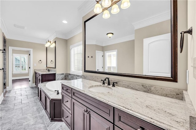 bathroom featuring crown molding, vanity, a healthy amount of sunlight, and a notable chandelier