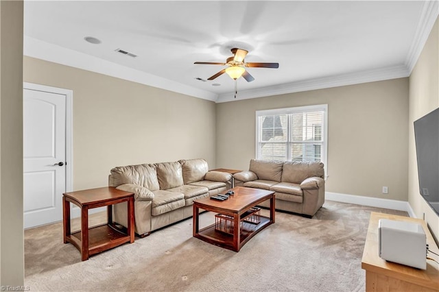 living room with crown molding, ceiling fan, and light carpet