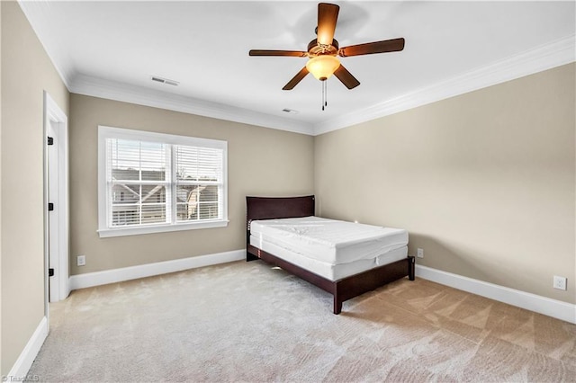 unfurnished bedroom featuring light carpet, ceiling fan, and crown molding