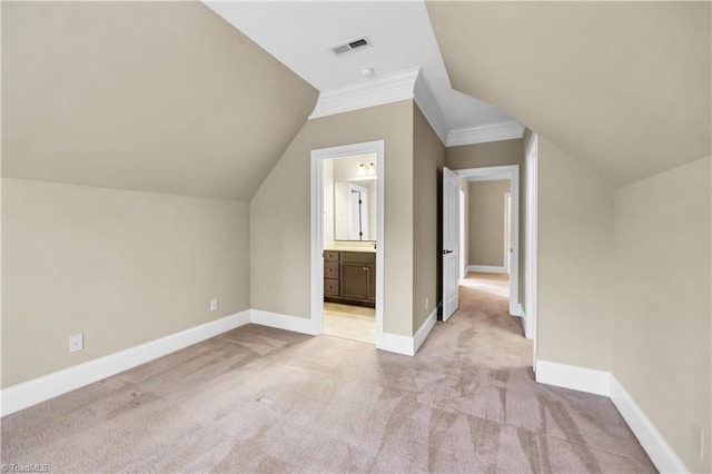 bonus room featuring light carpet and lofted ceiling