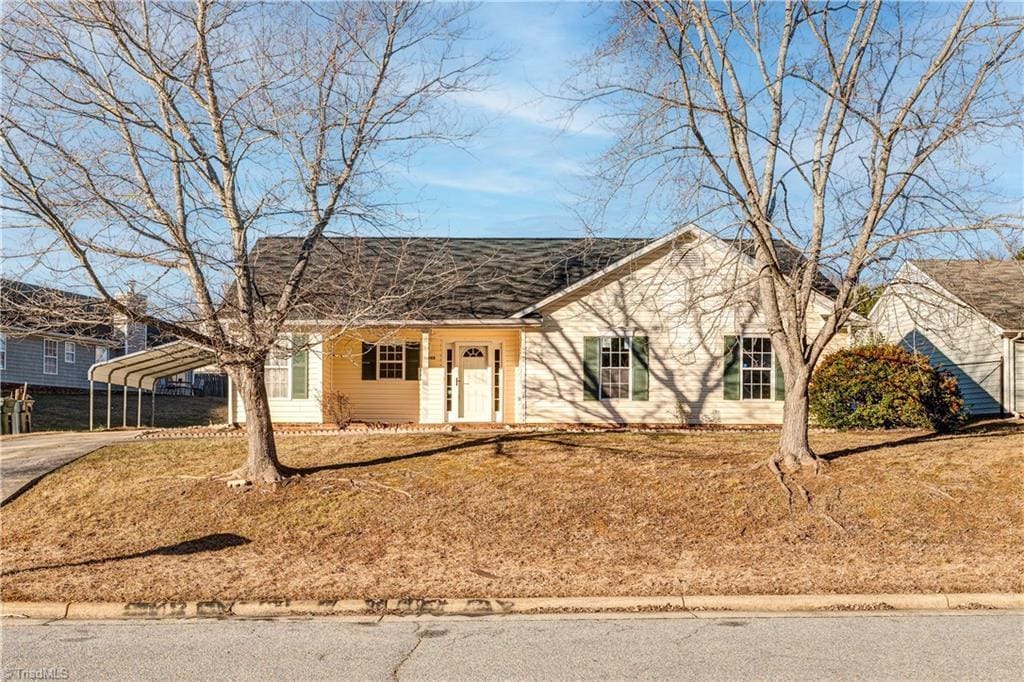 single story home with a carport