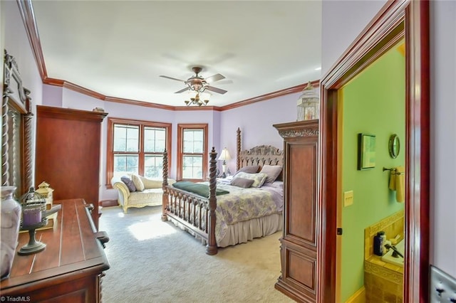 carpeted bedroom featuring ceiling fan and ornamental molding