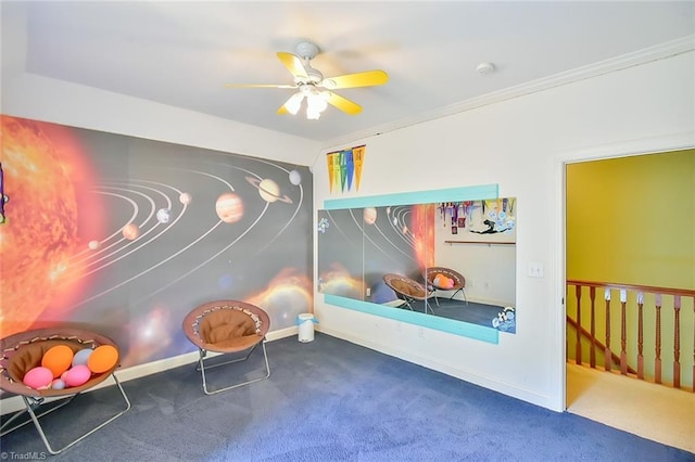 interior space featuring ornamental molding, carpet floors, and ceiling fan