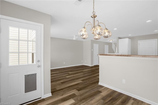 unfurnished dining area with dark hardwood / wood-style floors