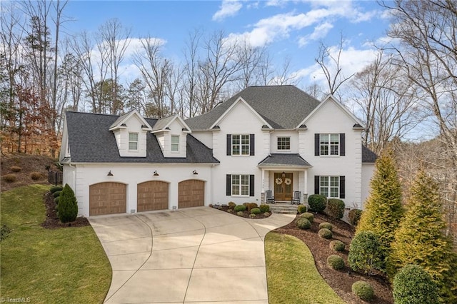 7745 Chesterbrooke Dr, Greensboro, NC 27455 - view of front of home featuring a garage and a front yard