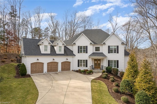 view of front of home featuring a garage and a front yard