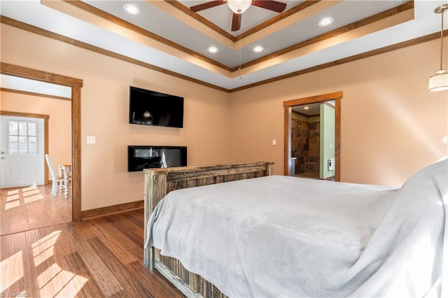 1420 Burnetts Chapel Rd, Greensboro, NC 27407 - bedroom with a raised ceiling, recessed lighting, wood finished floors, ornamental molding, and baseboards