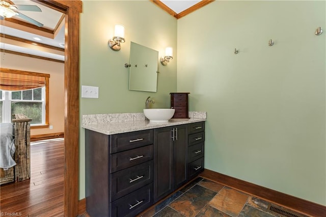 1420 Burnetts Chapel Rd, Greensboro, NC 27407 - bathroom featuring baseboards, vanity, ceiling fan, and ornamental molding