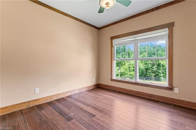 1420 Burnetts Chapel Rd, Greensboro, NC 27407 - spare room featuring ornamental molding, wood finished floors, baseboards, and a ceiling fan