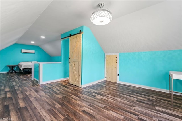 1420 Burnetts Chapel Rd, Greensboro, NC 27407 - additional living space with baseboards, wood finished floors, vaulted ceiling, a wall unit AC, and a barn door