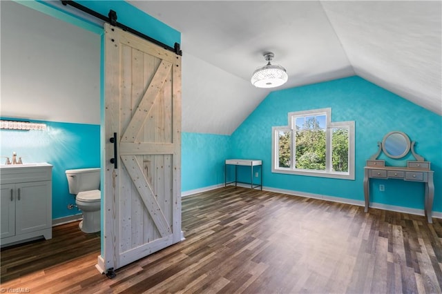 1420 Burnetts Chapel Rd, Greensboro, NC 27407 - bonus room featuring a barn door, wood finished floors, a sink, lofted ceiling, and baseboards