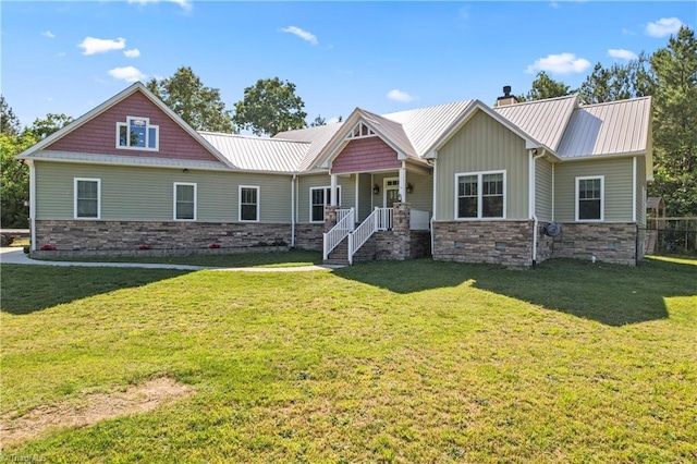 1420 Burnetts Chapel Rd, Greensboro, NC 27407 - craftsman-style house with stone siding, a porch, a chimney, a front lawn, and metal roof