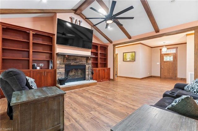 1420 Burnetts Chapel Rd, Greensboro, NC 27407 - living area with a ceiling fan, wood finished floors, a fireplace, and baseboards