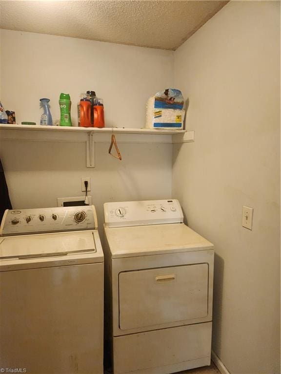 5517 Hornaday Rd Unit D, Greensboro, NC 27409 - laundry room featuring washing machine and clothes dryer