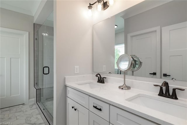 bathroom with vanity, ornamental molding, and an enclosed shower