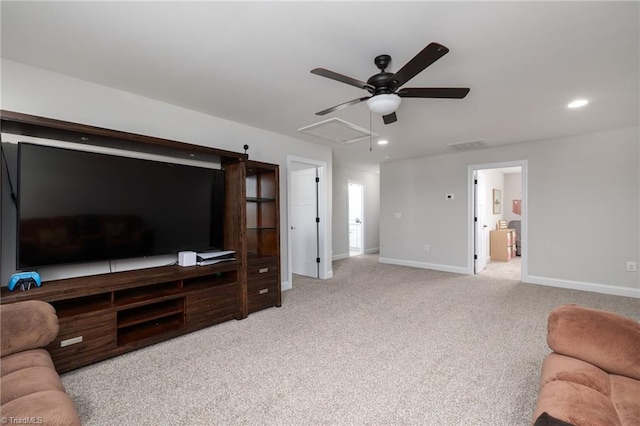 living room featuring light colored carpet, baseboards, attic access, recessed lighting, and a ceiling fan