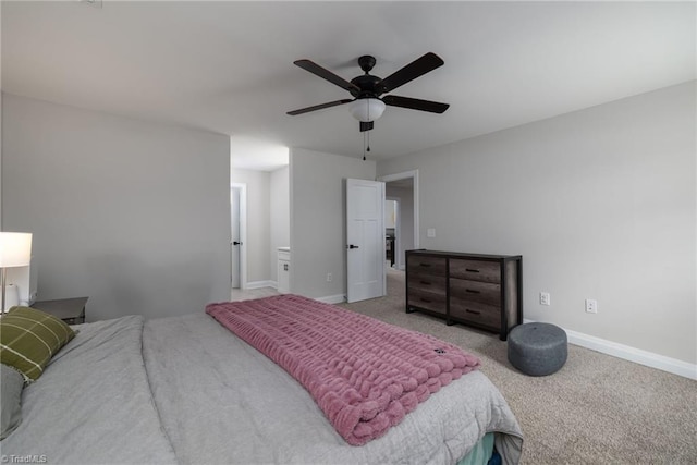 carpeted bedroom featuring a ceiling fan and baseboards