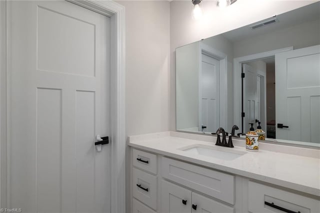 bathroom featuring visible vents and vanity