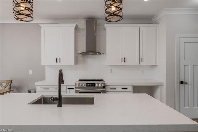kitchen featuring white cabinets, a sink, electric range, wall chimney exhaust hood, and backsplash