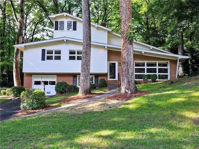 2841 Wesleyan Ln, Winston-Salem, NC 27106 - tri-level home featuring brick siding, a garage, and asphalt driveway