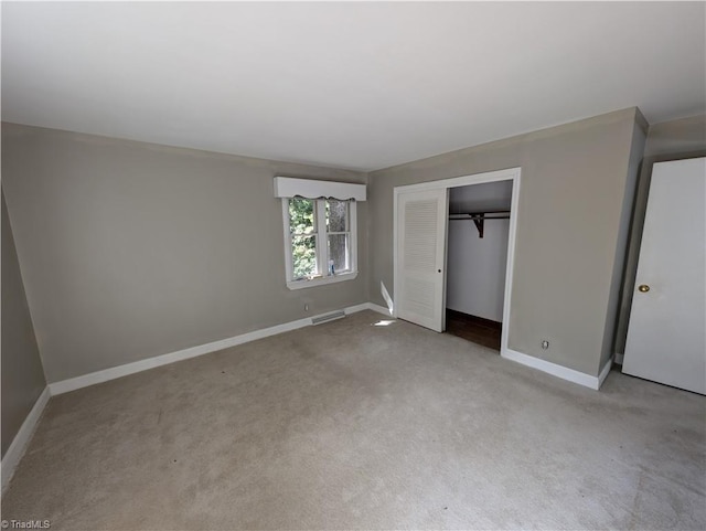 2841 Wesleyan Ln, Winston-Salem, NC 27106 - unfurnished bedroom featuring baseboards, carpet, and a closet