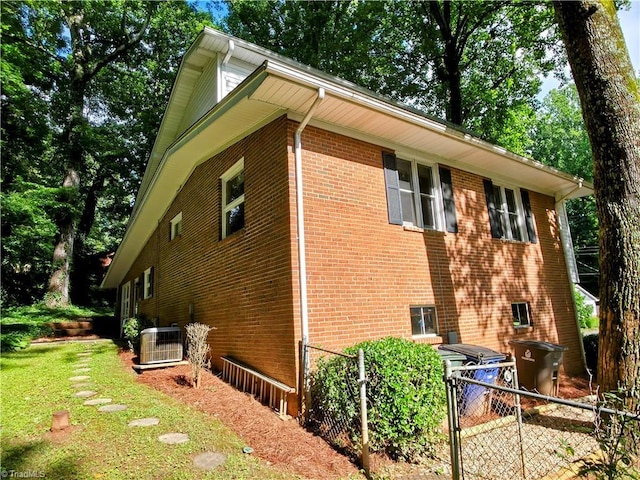 2841 Wesleyan Ln, Winston-Salem, NC 27106 - view of side of property featuring cooling unit, brick siding, and a gate