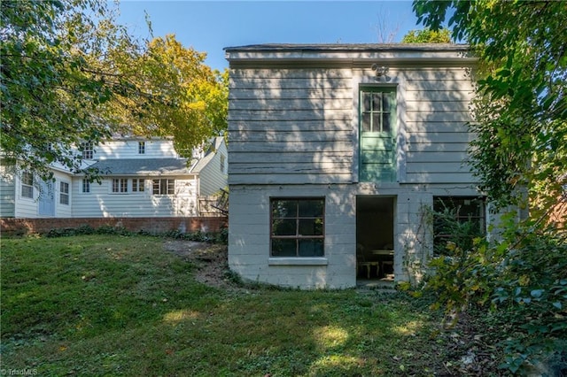 view of home's exterior featuring a yard