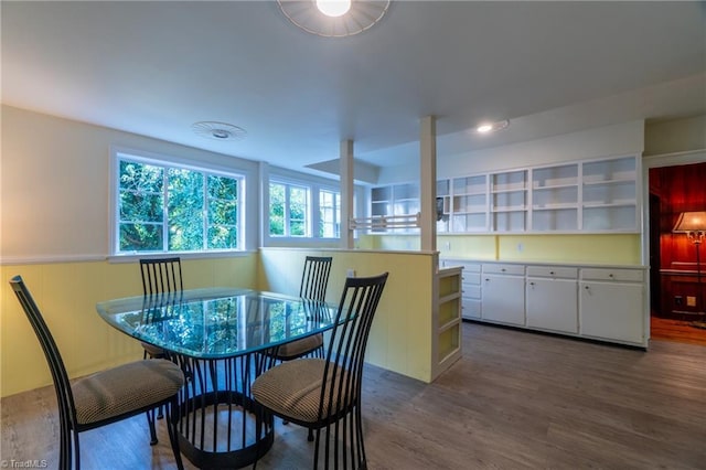 dining area with dark hardwood / wood-style floors