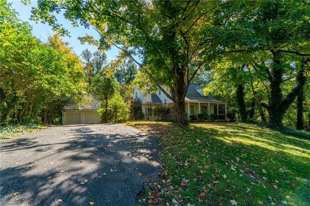 view of front facade with a garage and a front lawn