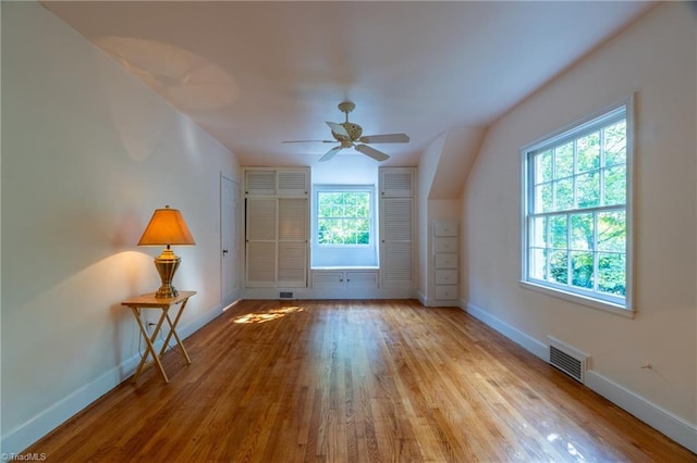 additional living space featuring light hardwood / wood-style flooring and ceiling fan