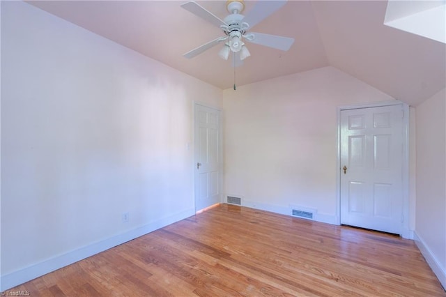 unfurnished room featuring ceiling fan, lofted ceiling, and light hardwood / wood-style floors