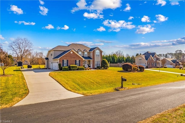 view of front of home featuring a front yard and a garage