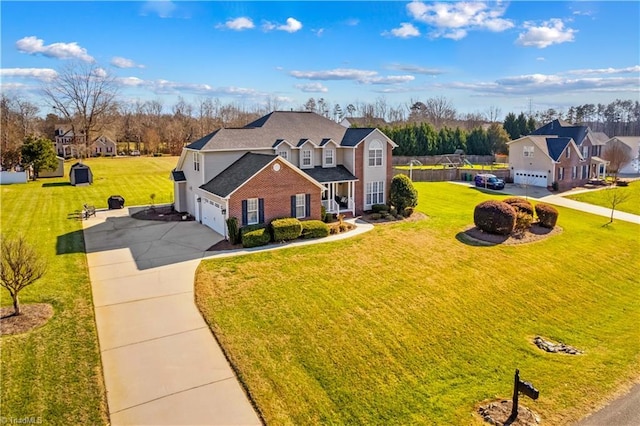 front of property with a garage and a front lawn