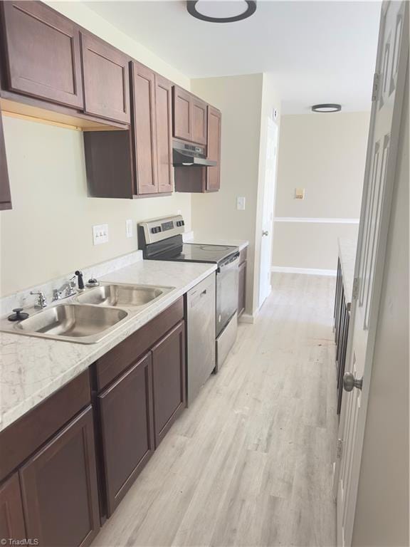 3109 Darden Rd Unit B, Greensboro, NC 27407 - kitchen with appliances with stainless steel finishes, ventilation hood, light wood finished floors, and light countertops