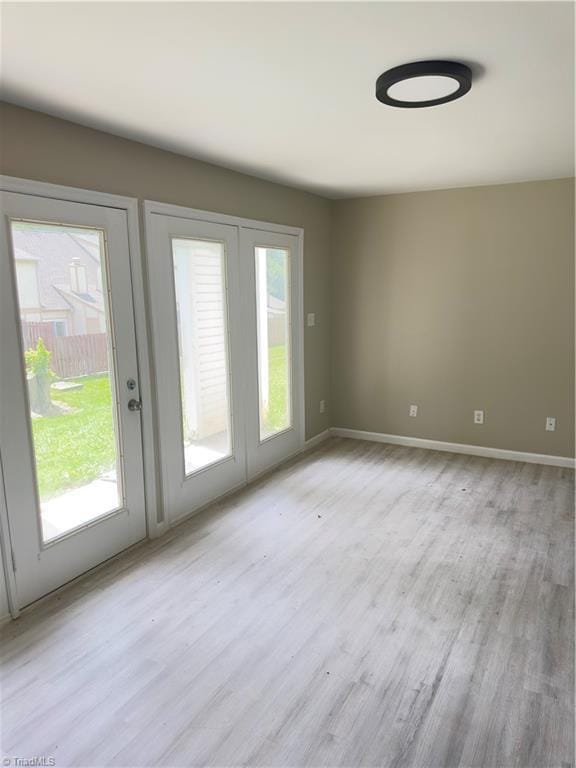 3109 Darden Rd Unit B, Greensboro, NC 27407 - empty room featuring light wood-style flooring and baseboards