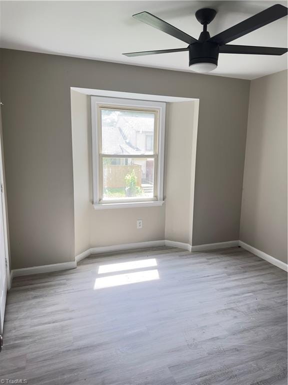 3109 Darden Rd Unit B, Greensboro, NC 27407 - empty room with wood finished floors and a ceiling fan