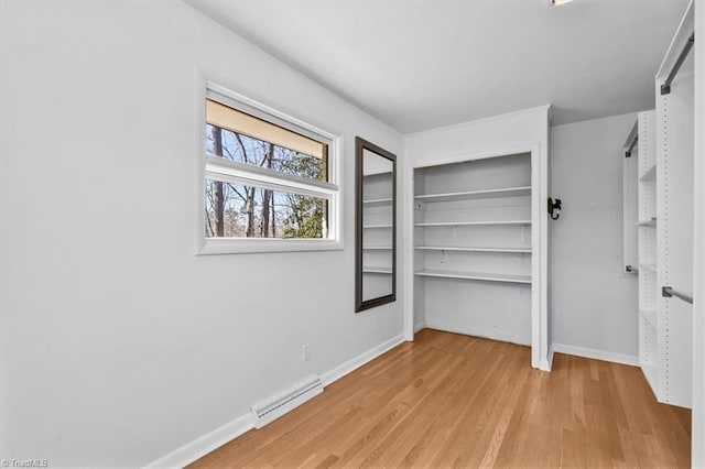 unfurnished bedroom featuring visible vents, baseboards, and light wood-style floors