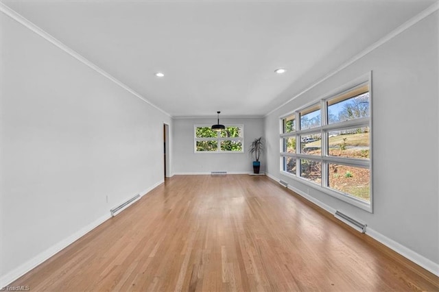 unfurnished room with baseboards, visible vents, recessed lighting, light wood-style floors, and crown molding