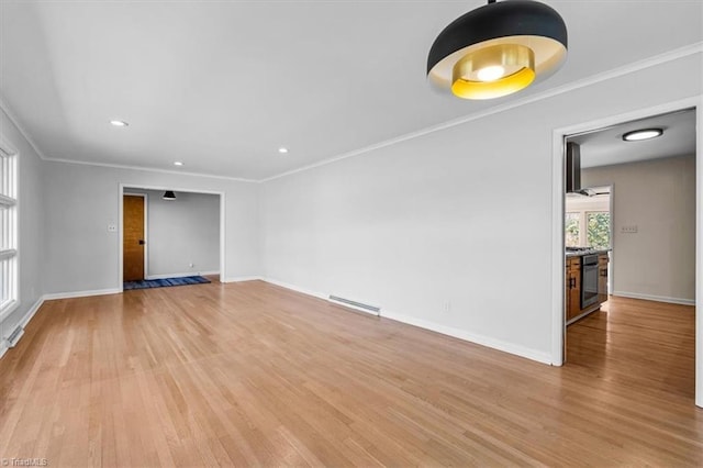 unfurnished room featuring visible vents, ornamental molding, recessed lighting, light wood finished floors, and baseboards