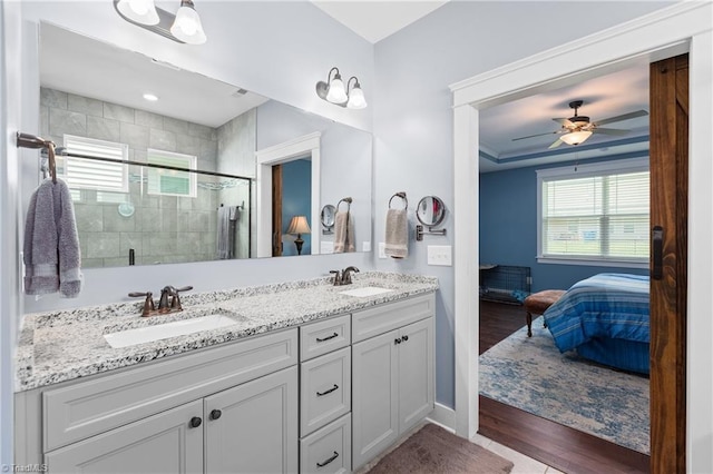 254 Kilbourne Dr, Advance, NC 27006 - bathroom featuring ensuite bath, double vanity, a stall shower, wood finished floors, and a ceiling fan