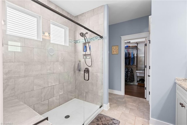 254 Kilbourne Dr, Advance, NC 27006 - bathroom with vanity, a stall shower, and a spacious closet